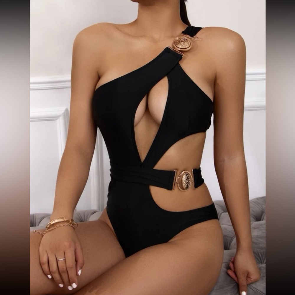 Black one piece swimsuit with cut out and gold details